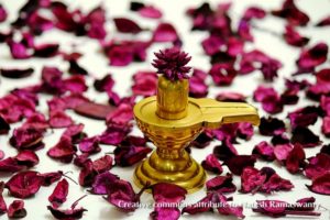gold shiva lingam with purple flowers, lingashtakam