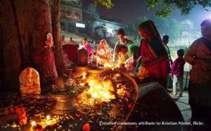 nightime shiva linga festival with oil lamps