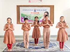 kids school uniforms standing namaste