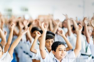 amrita yoga kids with arms raised