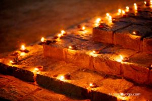 puja lamps on steps