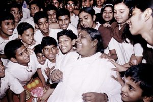 Amma laughing with children