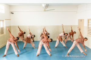 young people doing standing pose, bangalore yoga program